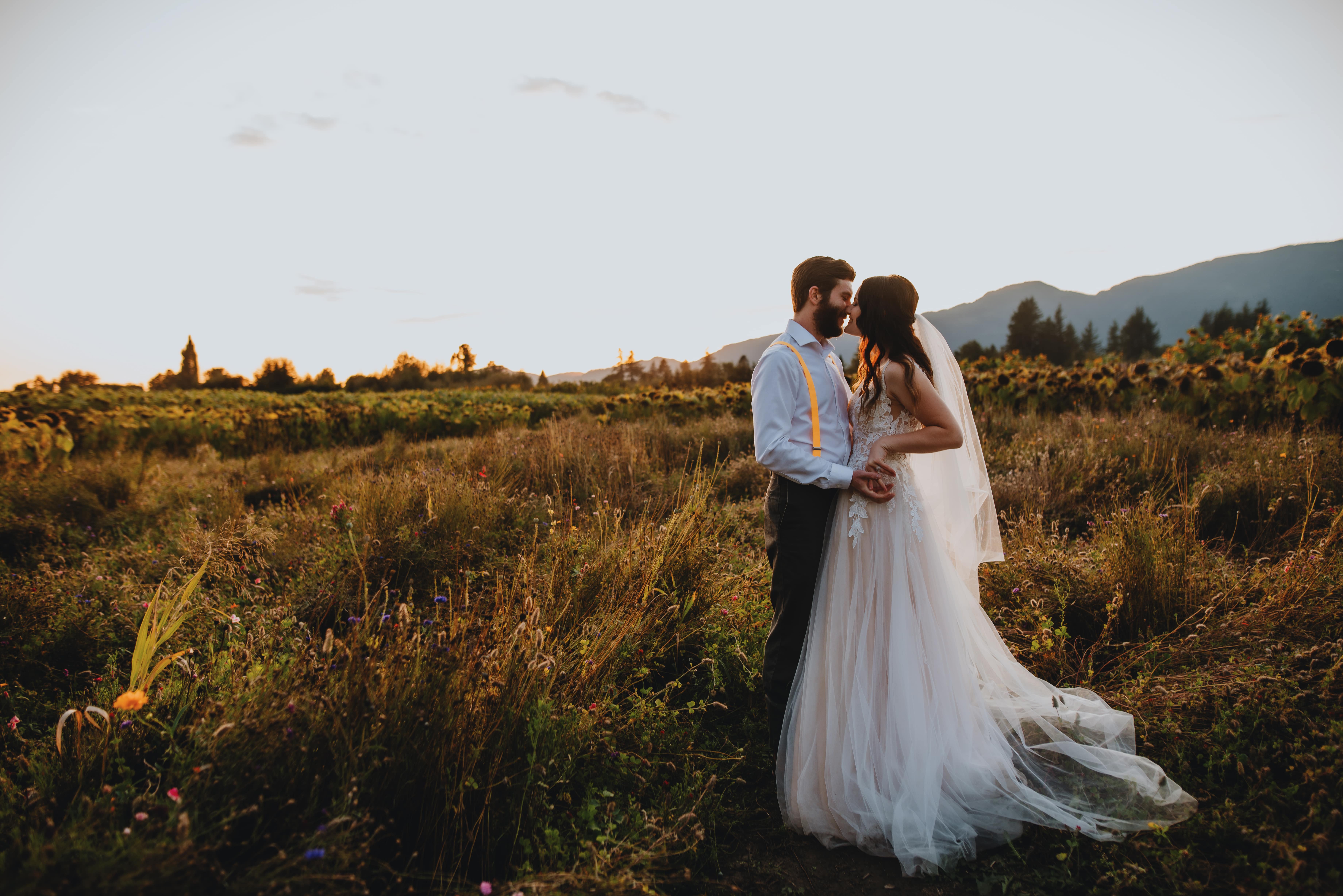 bride and groom's first look on their wedding day in a field