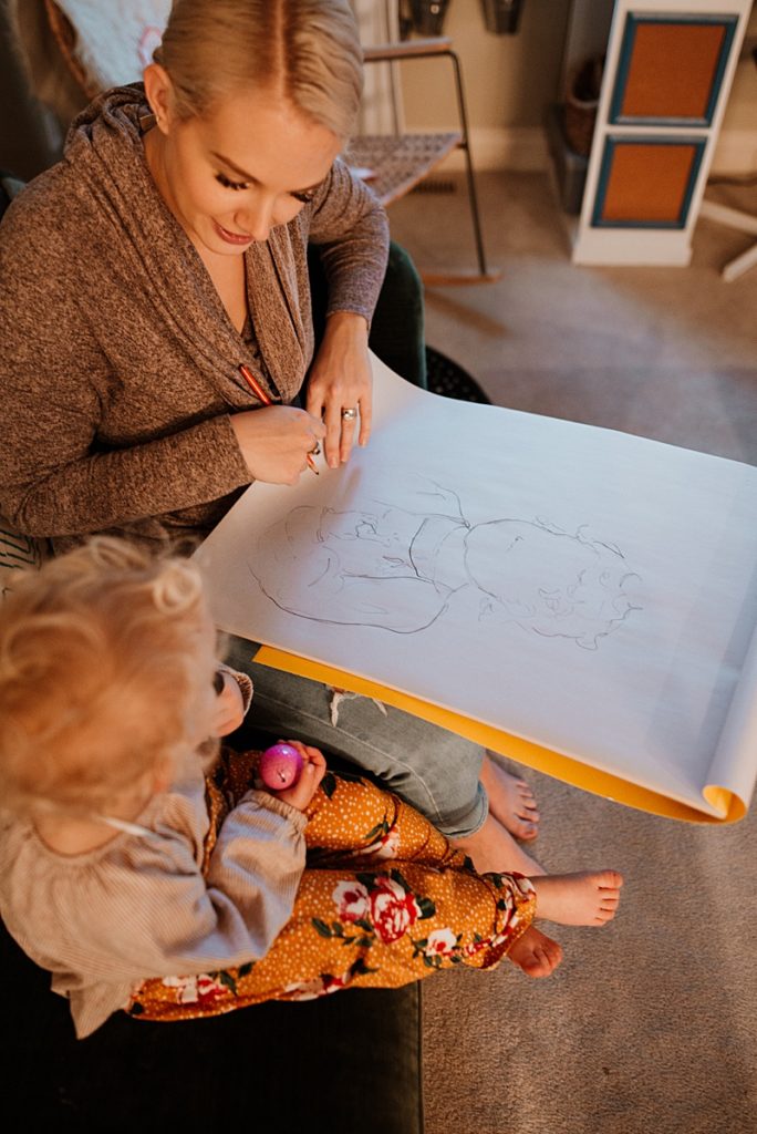Chalie, lifestyle artist, sketching her daughter