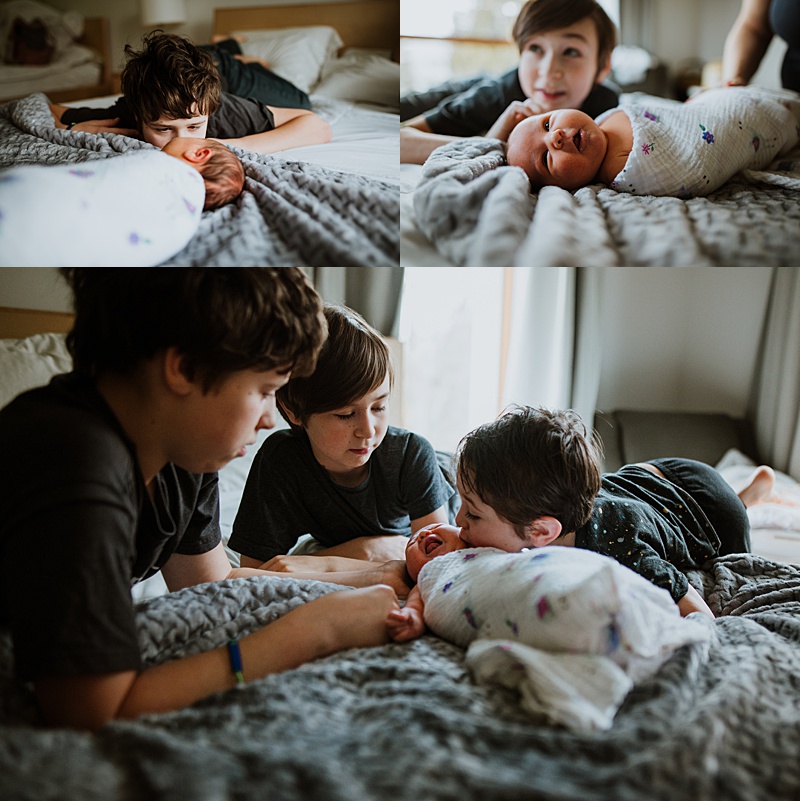 baby Ella getting all the attention from her big brothers during our newborn photography session