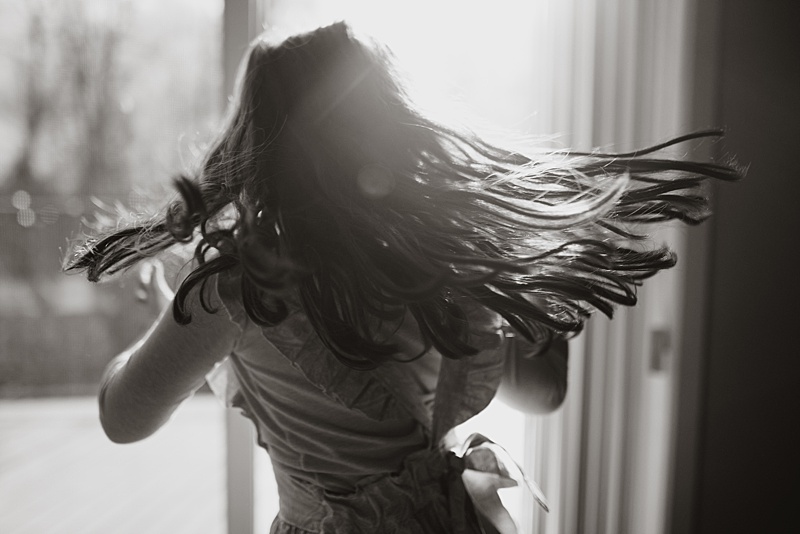 An image of my daughter twirling in the sunlight from my 365 Challenge.