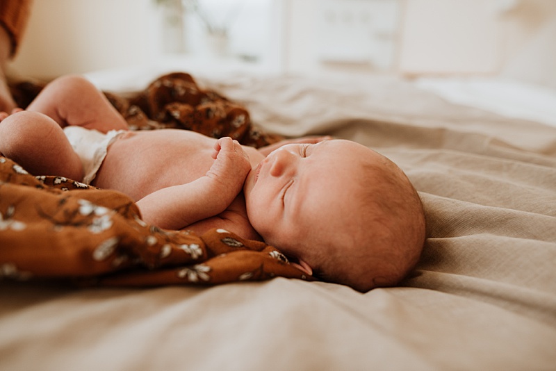 Newborn baby laying on bed. Doulas of Vancouver are a great option for your pre-natal, birth and postpartum support.