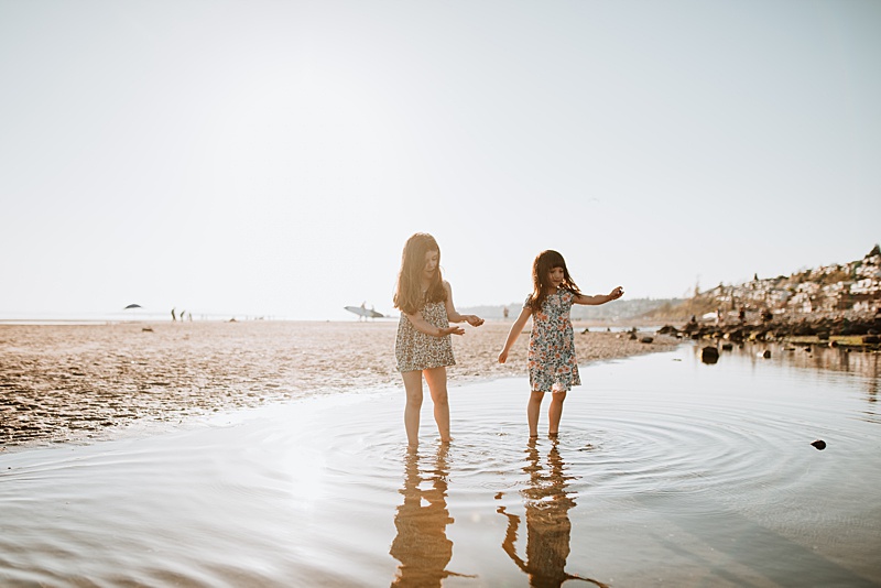 Little girls playing at the beach. Find the best North Shore Montessori school for your little one.