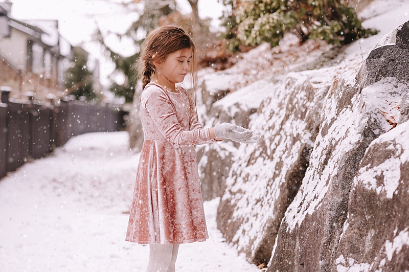 Little girl playing in the snow. Holiday events in Vancouver