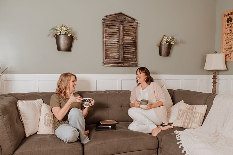 Clients laughing and having coffee during relaxed branding session