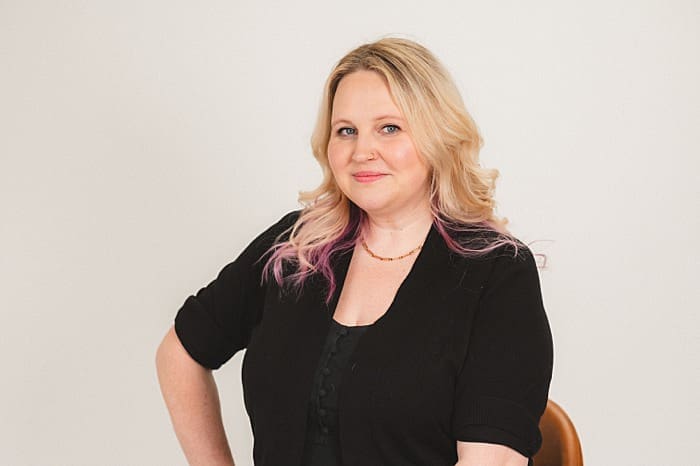 Creative business owner smiling during headshot session – brand photography in Vancouver

