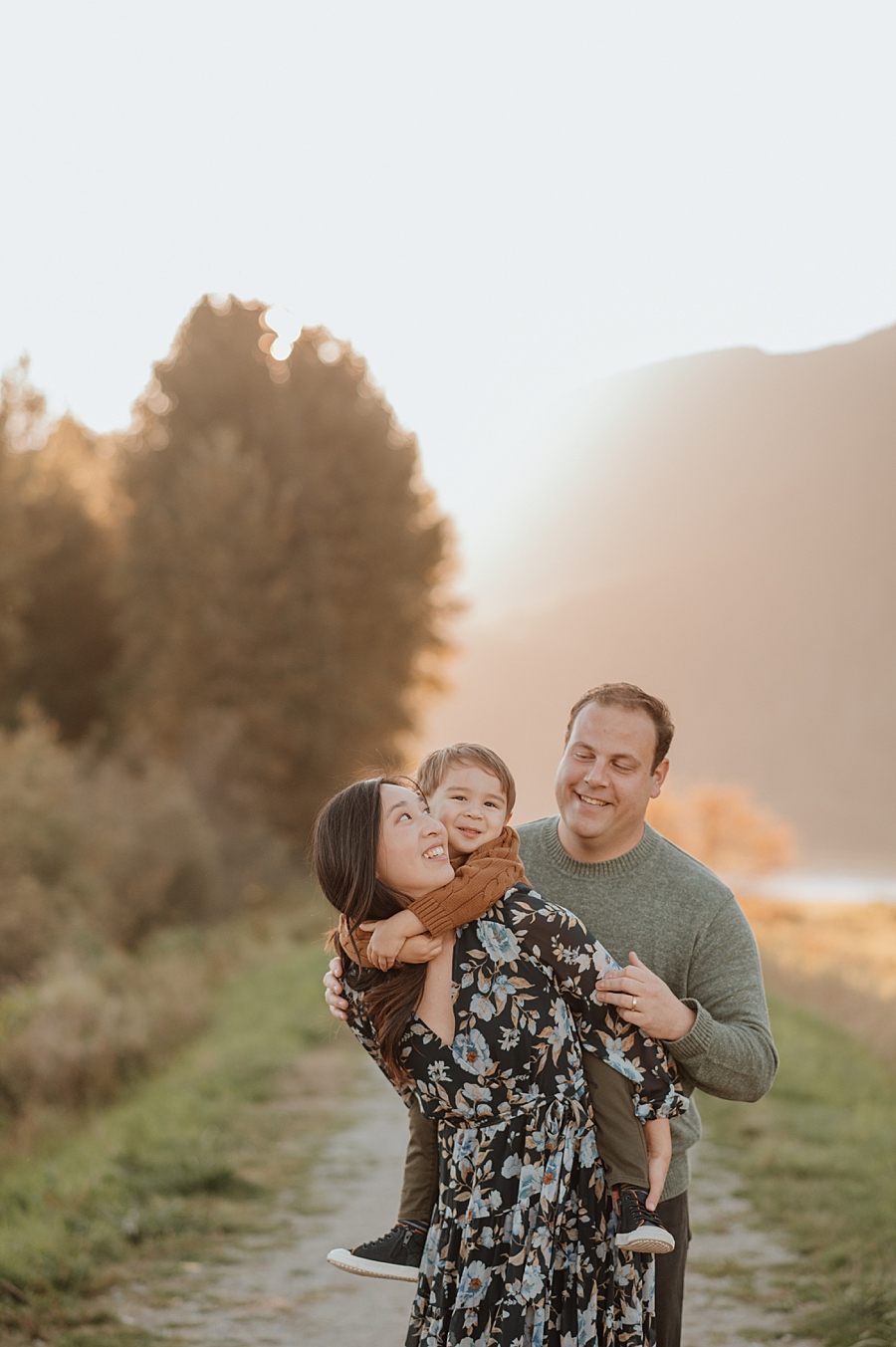 Family of three during a sunset fall family photography session
