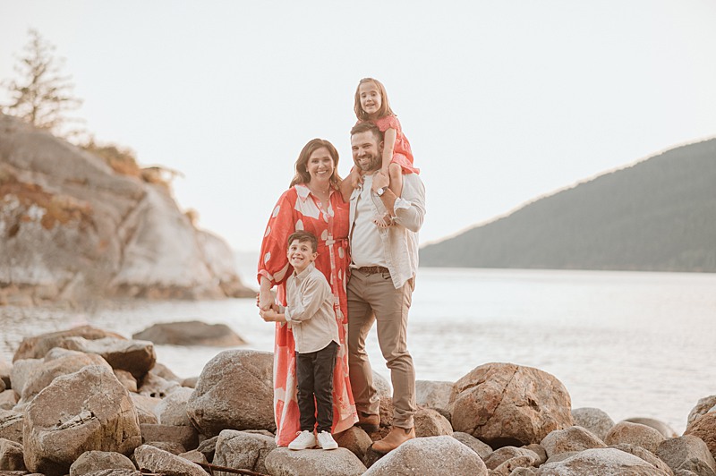 Mom and dad with little boy and girl at Whytecliff Park in Vancouver during luxury family photo session