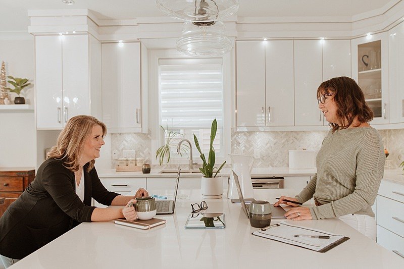 Two business owners working with their laptops open