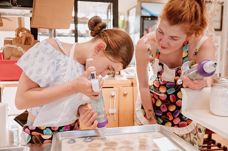 Photo of local baker teaching kids baking class during brand story session